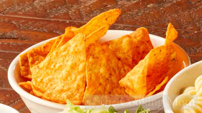 Crush up tortilla chips.