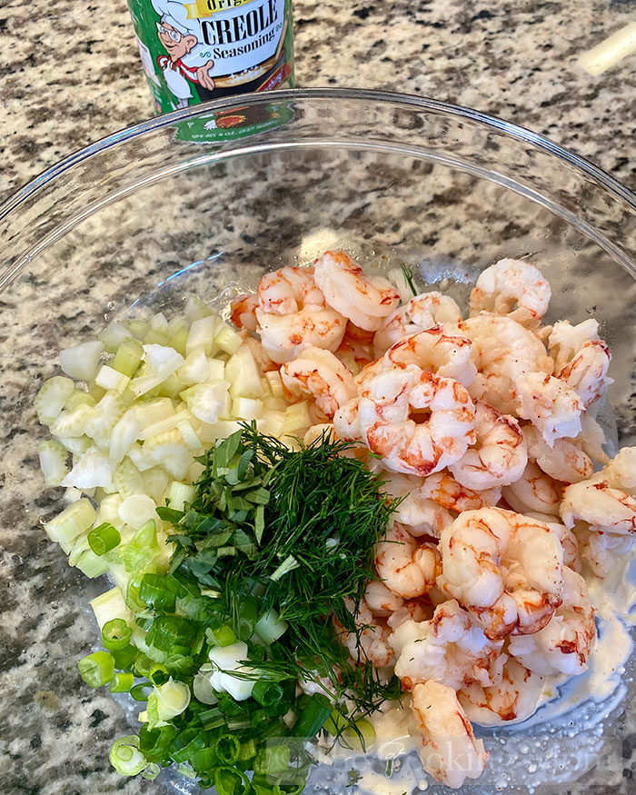 Celery, onions, herbs and shrimp ready for mixing